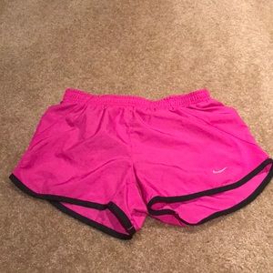 Pink and black nike running shorts